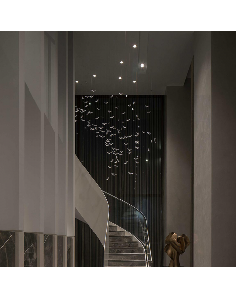 The villa has a handmade bird decorated chandelier in the living room