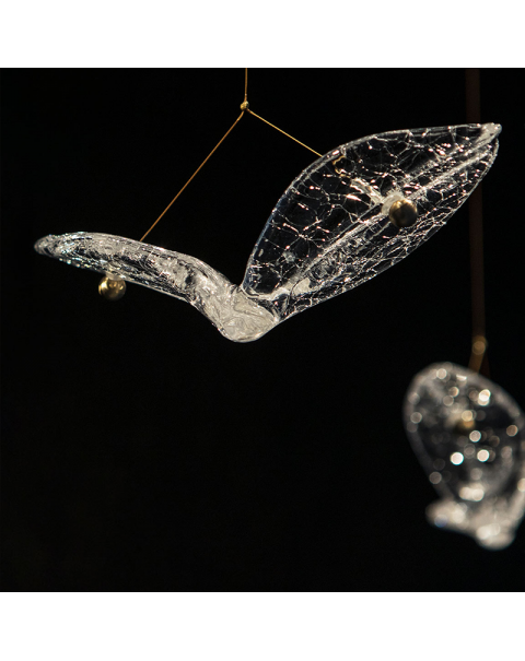 The villa has a handmade bird decorated chandelier in the living room